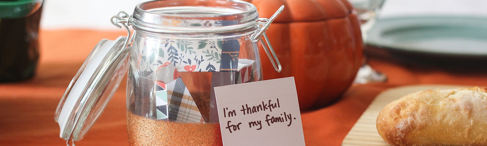 A mason jar filled with patterned handwritten cards A mason jar filled with patterned handwritten cards