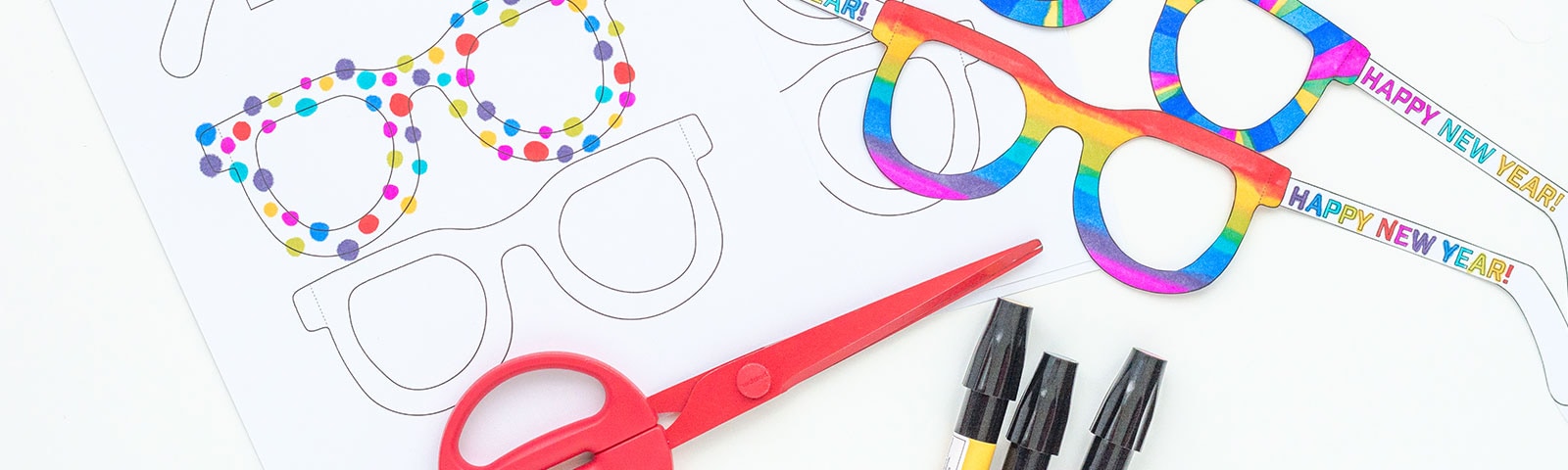 Printable, colorful eyeglasses shapes with a pair of scissors and markers