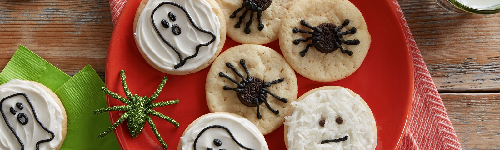 Halloween cookies on a plate. One decorated as a ghost with another decorated as a spider. Halloween cookies on a plate. One decorated as a ghost with another decorated as a spider.