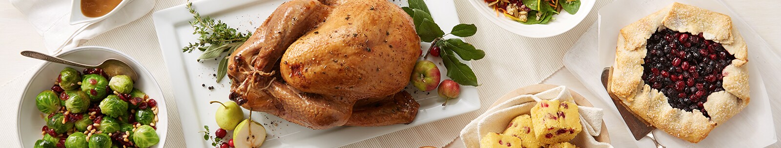 A table filled with Thanksgiving dishes